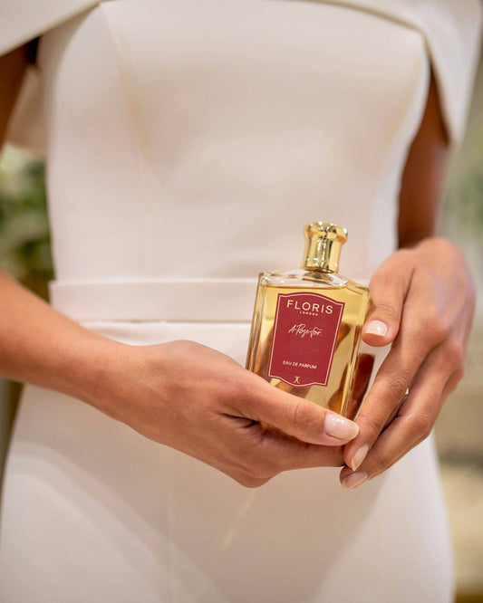 Bride holding customised perfume bottle