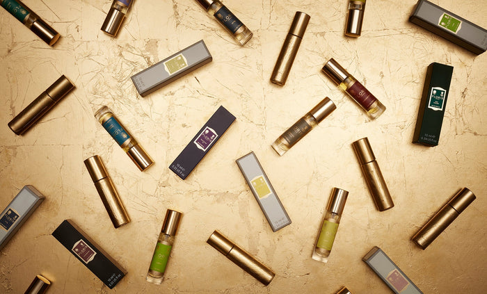 perfume bottles on a gold background