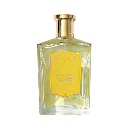 Clear glass bottle of Floris London's Bergamotto di Positano - Eau de Parfum with a gold cap, yellow label, and a hint of bergamot essence.
