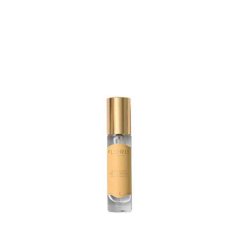 A small bottle of Floris London Bouquet de La Reine Eau de Toilette with a gold cap and beige label on a white background, offering fruity floral notes.