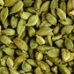 Close-up of whole green cardamom pods, whose citrusy scent inspires Floris London Cefiro Eau de Toilette—a unique unisex fragrance.