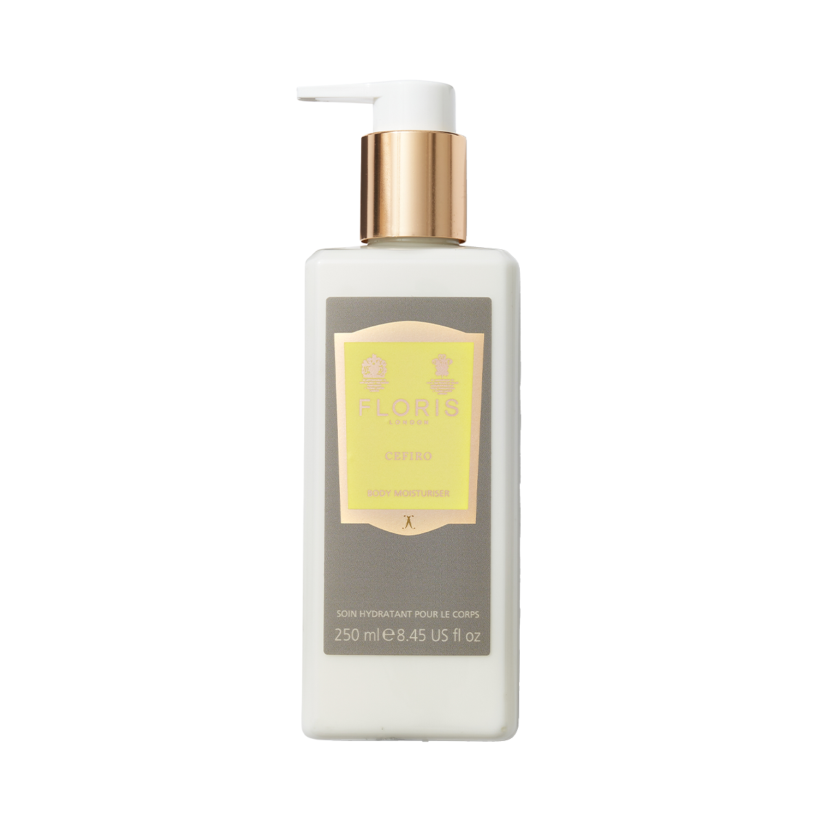 White bottle of Floris London Cefiro – Enriched Body Moisturiser with gold pump and yellow label, enriched with jojoba oil, on a plain background.