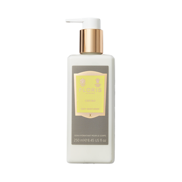 White bottle of Floris London Cefiro – Enriched Body Moisturiser with gold pump and yellow label, enriched with jojoba oil, on a plain background.
