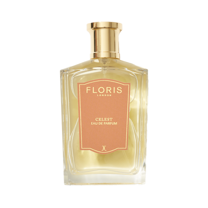 A clear glass bottle of Floris London UK Celest - Eau de Parfum with a gold cap and peach label, filled with light yellow perfume, on a white background.