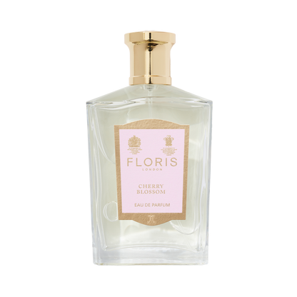 Floris London's Cherry Blossom Eau de Parfum, in a clear glass bottle with a gold cap and pink label, exudes luxury and elegance.