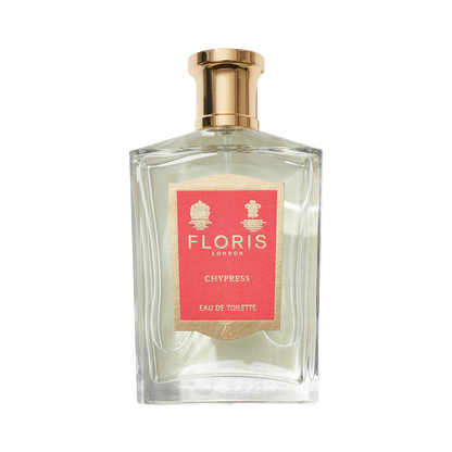 Perfume bottle with a gold cap, red label from Floris London featuring "Chypress - Eau de Toilette," infused with bergamot zest.