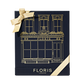 Navy blue Floris London UK Sweet Lux | Honey Oud Duo gift box with gold illustration, a gold bow, and luxurious Honey Oud Eau de Parfum inside.