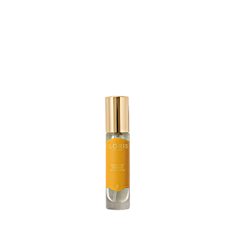 Floris London's Golden Amber Eau de Parfum in a clear glass bottle with a golden cap and orange label.