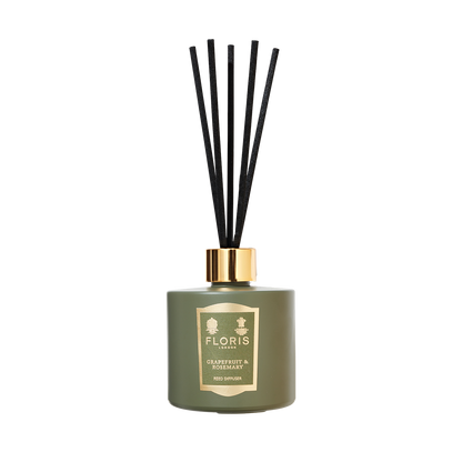 Grapefruit & Rosemary diffuser by Floris London with black reeds, gold label, and notes of sandalwood.