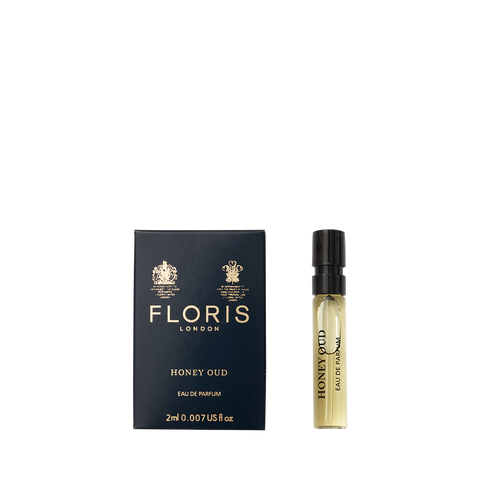 A 2ml sample of Floris London's Honey Oud eau de parfum has a black box on the left and a small vial on the right.