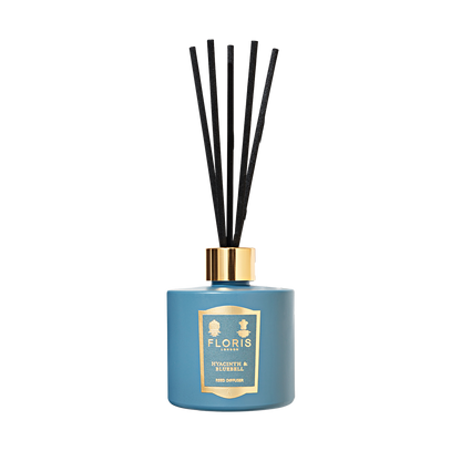Floris London's Hyacinth & Bluebell - Reed Diffuser (200ml) features a sleek glass vessel with black reeds, filling the air with a green floral fragrance.