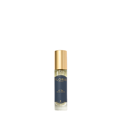 A small bottle of Floris London's No. 89 Eau de Toilette with a gold cap and dark blue label, ideal as a gentleman's signature scent.