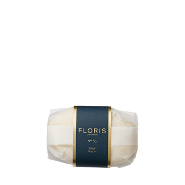 A wrapped bar of Floris London No. 89 - Luxury Soap with a dark blue and gold label is displayed on a white background.