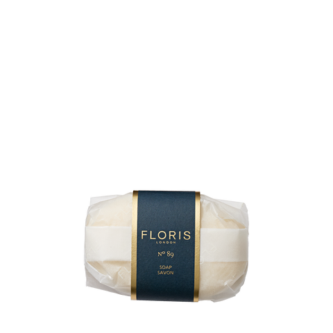A wrapped bar of Floris London No. 89 - Luxury Soap with a dark blue and gold label is displayed on a white background.