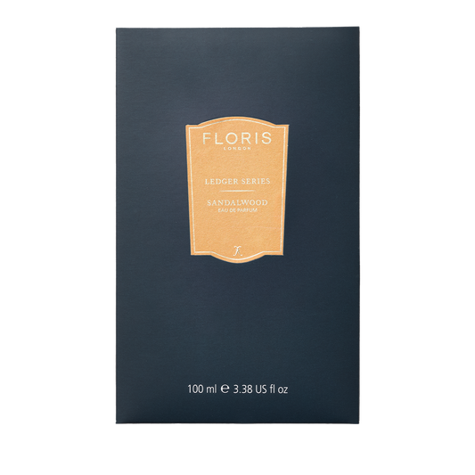 Navy box with a gold label featuring the "Floris London UK Sandalwood" fragrance from the Ledger Series, enriched with sandalwood oil.