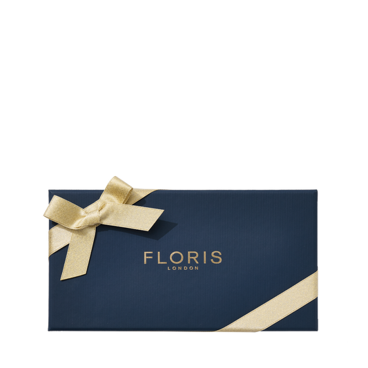 Navy blue Floris London gift box with a gold ribbon, featuring the Soap Collection | For Her, on a white background.