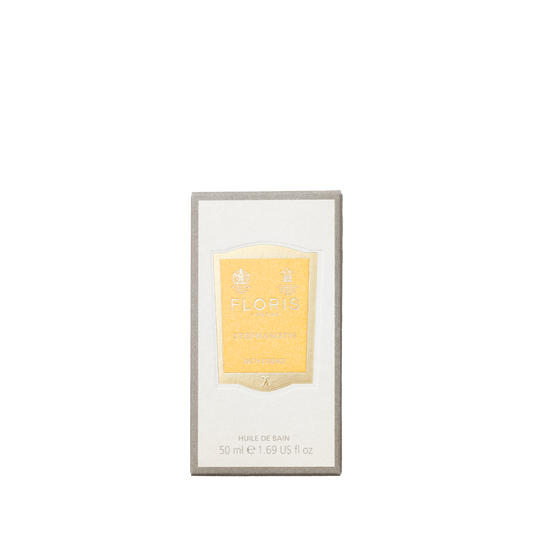Stephanotis Bath Essence by Floris London features a floral scent, elegantly presented in a gold-labeled bottle within a rectangular box.