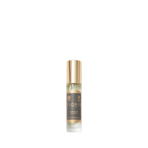 A small bottle of Floris London's "Tuberose in Silk" Eau de Parfum with a golden cap and beige-dominant label exudes rich jasmine notes.