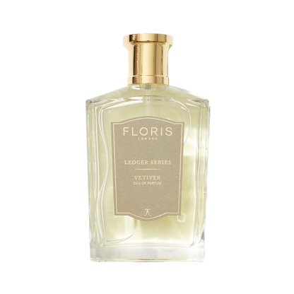 Elegant vetiver scent in a transparent bottle with a gold cap, labeled "Floris London UK Vetiver Eau de Parfum.