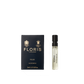 A deep blue box of Floris London Wilde - Eau de Parfum sits beside a small clear spray vial, representing freedom and individuality.